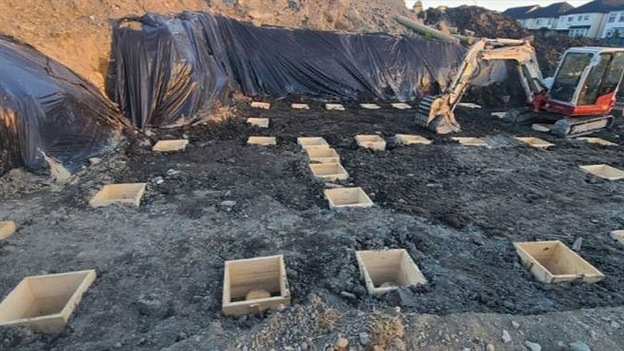 Excavated foundation with footing pads and formwork laid out