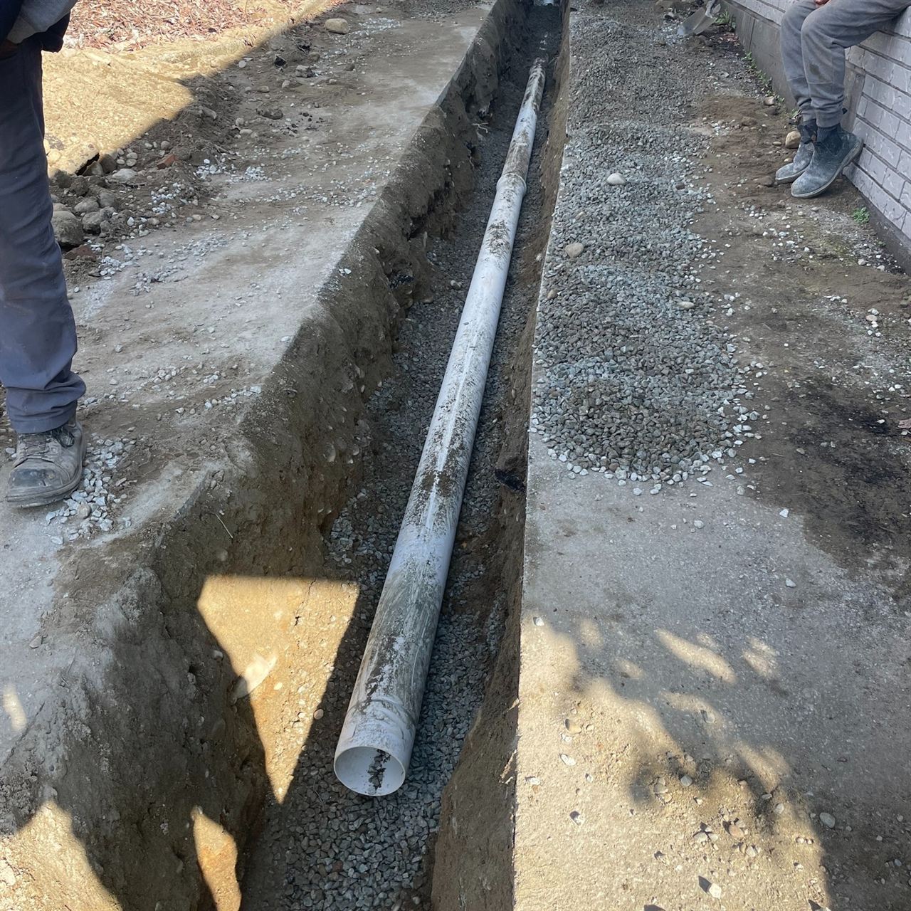 Service line laid in a gravel-bedded trench