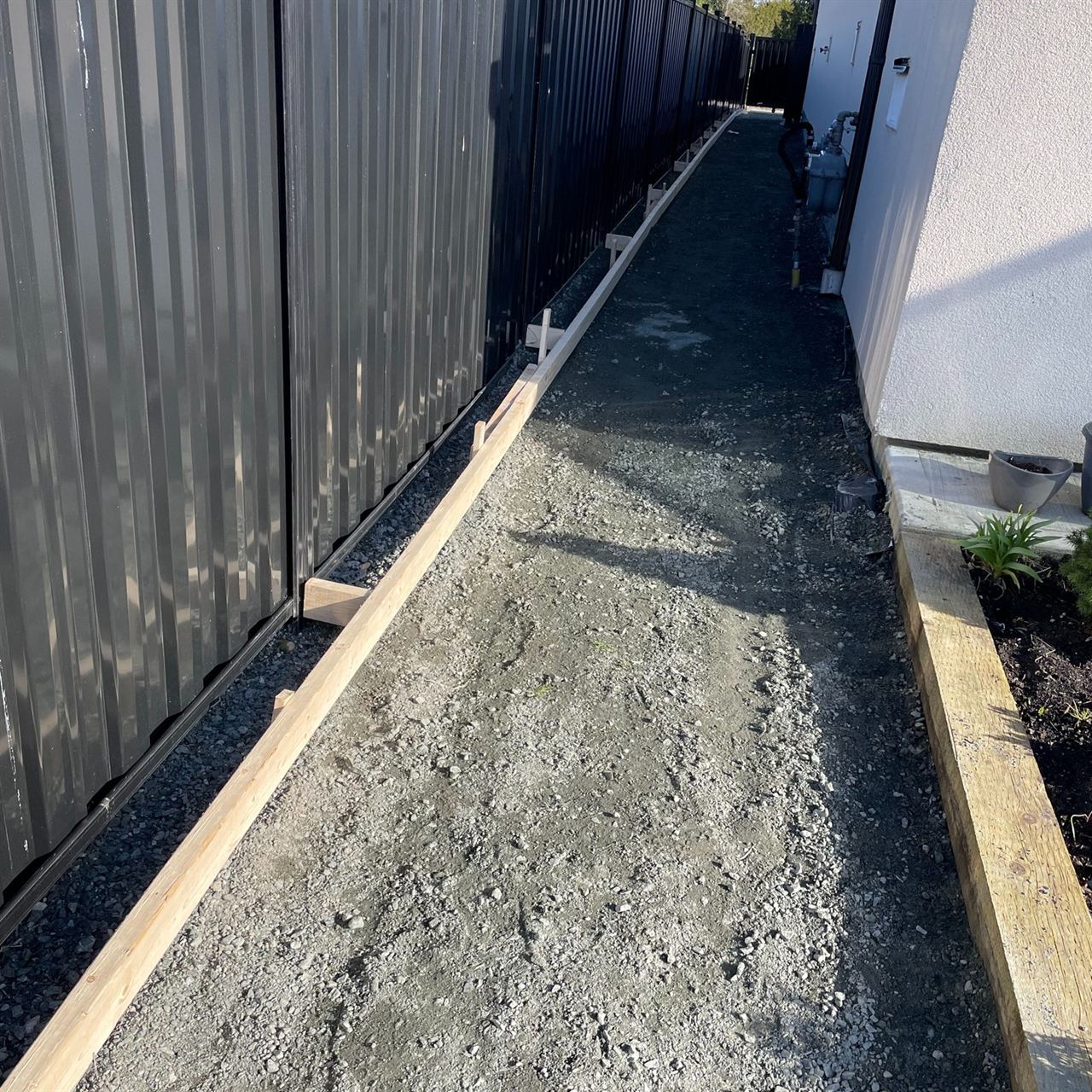 Asphalt paving prep — gravel base and edging set for surface pour